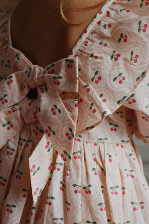 Robe Konges Sløjd "Cianna" motif nœud cerise rose