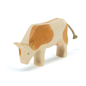 Animal en bois Ostheimer « Vache brune paissant »
